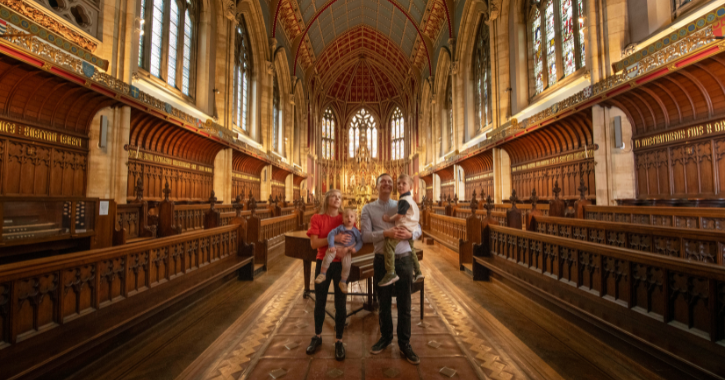 Family of four walking through St Cuthbert's Chapel at Ushaw Historic House, Chapels and Gardens.